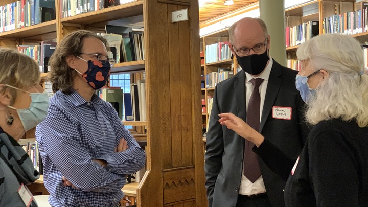 Sharon Wiles-Young, Director of Library Access chats with Provost Nathan Urban and celebrated authors