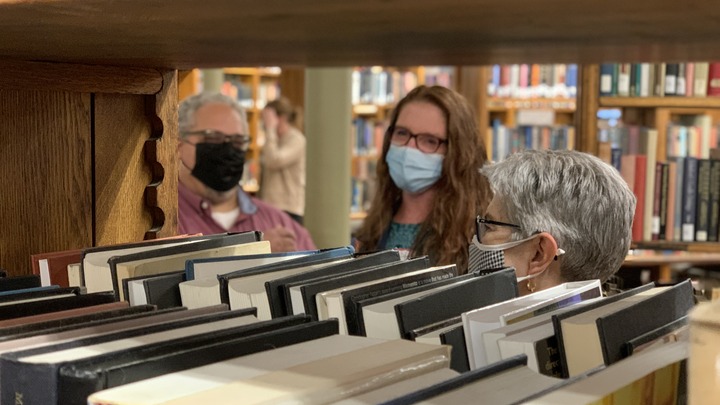 Guests mingling in book stacks in Linderman Library Rotunda