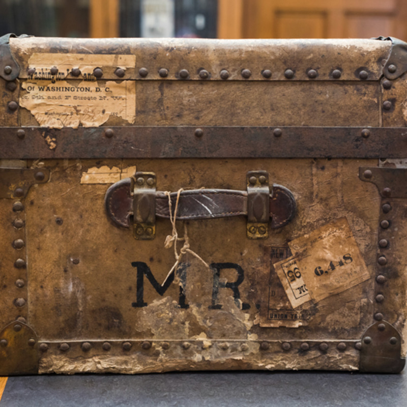 A chest bearing Miles Rock's initials.
